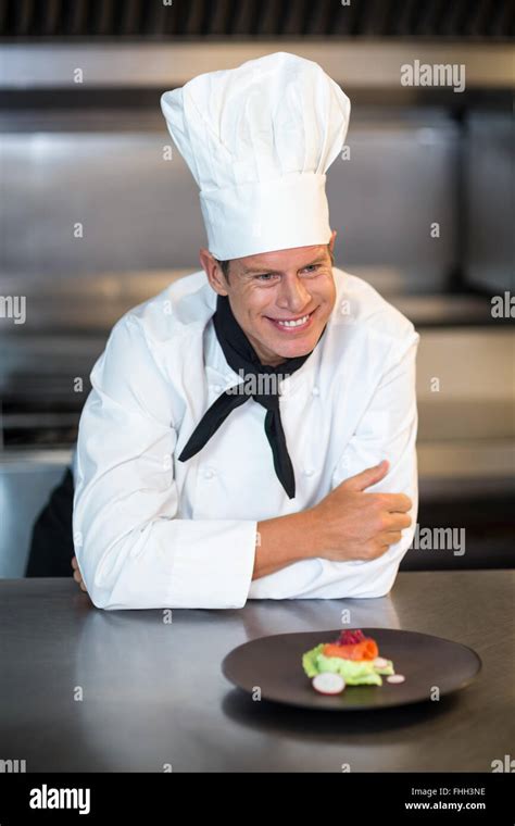 Happy chef with his dish Stock Photo - Alamy