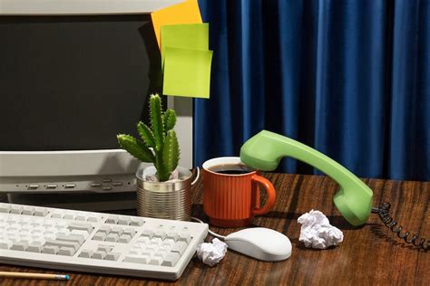 Free Photo | Messy office desk with old computer still life