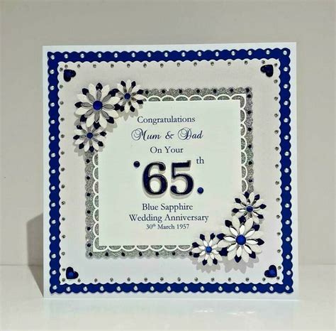 A White And Blue Wedding Anniversary Card With Flowers