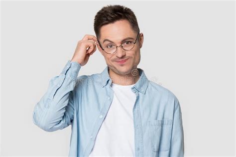 Puzzled Caucasian Man In Glasses Isolated On Grey Background Stock