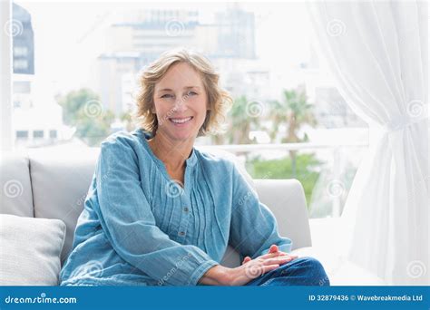 Content Blonde Woman Sitting On Her Couch Stock Photo Image Of Home