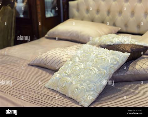 Modern luxury bed with pillows Stock Photo - Alamy