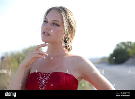 Portrait Of A Hungarian Blonde Woman Wearing A Red Dress On A Sunny Day Stock Photo Alamy