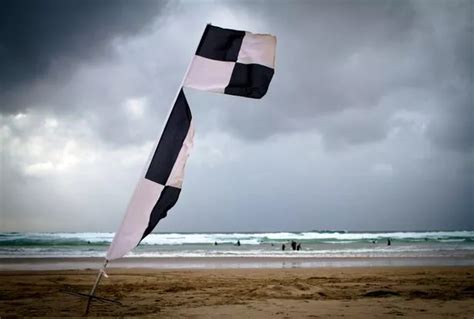 How To Stay Safe At The Beach And What Those Flags Actually Mean