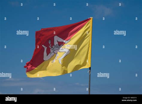 Sicilian Flag Flying Against A Blue Sky Erice Sicily Stock Photo Alamy