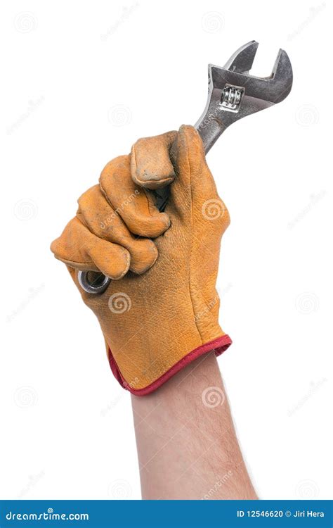 Adjustable wrench in hand stock photo. Image of metal - 12546620