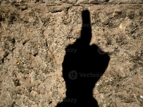 Fuck You Off Medium Finger Raised Hand Silhouette On Wall 12012092 Stock Photo At Vecteezy