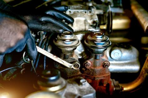 Premium Photo Cropped Hands Of Mechanic Repairing Car Engine