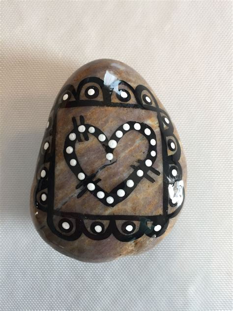 A Rock With A Heart Painted On It