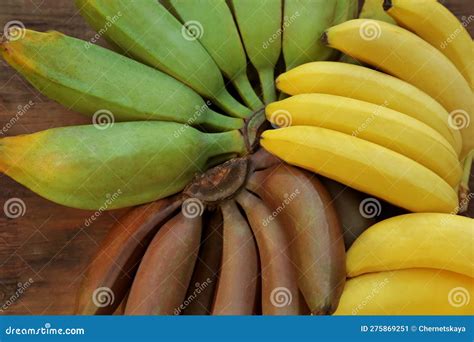 Different Sorts Of Bananas On Wooden Table Top View Stock Image