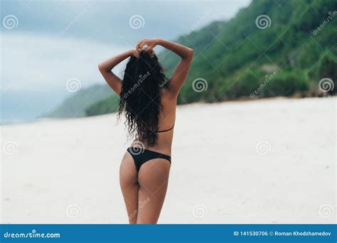 Backside View Of Dark Skined Girl With Booty In Bikini Resting On