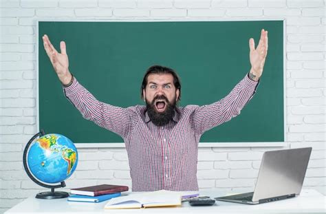 Premium Photo Mature Bearded Man Teacher In Costume Sit In School Classroom With Geography