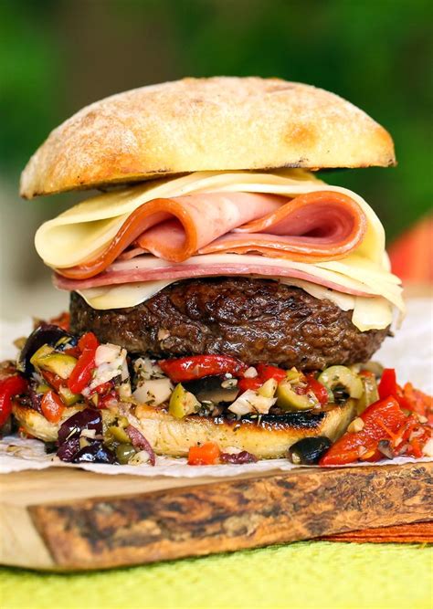 13 Inspired Burgers To Excite Your Tastebuds This Summer ~ Muffaletta Cheeseburger Burger