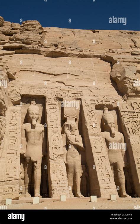 Rock Hewn Statues Of Ramses Ii Left And Right And Queen Neferatri