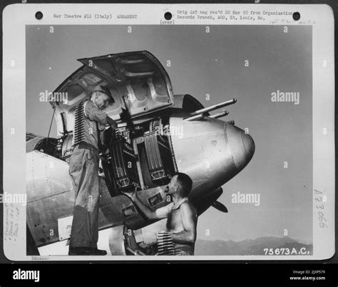 Armorers Load Ammunition In The Nose Of A Lockheed P 38 Lightning Of The 94th Fighter Squadron