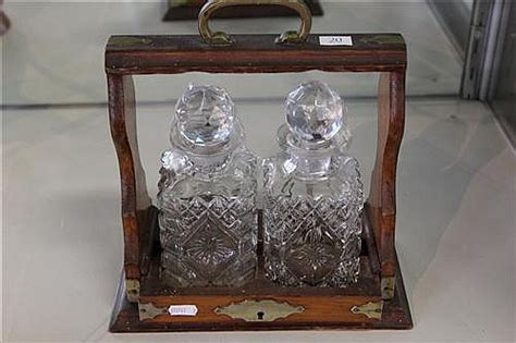 Lot Oak Tantalus With 2 Glass Decanters