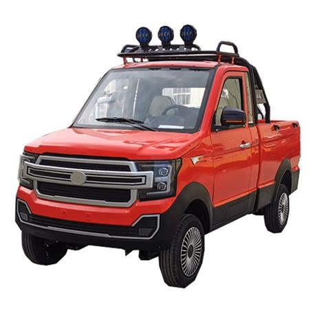 A Red Truck With Two Lights On The Roof And Four Wheels Parked In Front