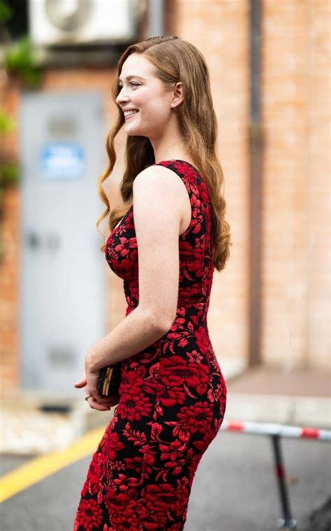 Larsen Thompson In A Red Floral Dress Attends The Antonio Marras