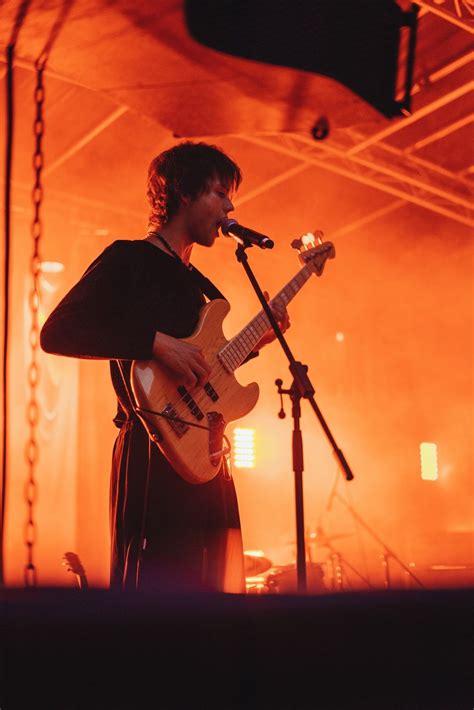 Man In Black Shirt Playing Guitar Photo Free Person Image On Unsplash