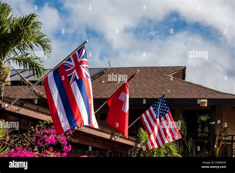 Maui, Hawaii. Hawaiian flag, the flag of Switzerland and the American ...