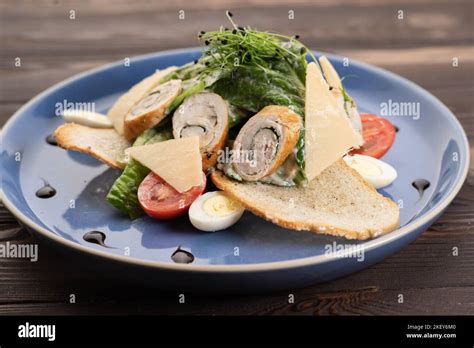 Caesar Salad With Croutons Quail Eggs Cherry Tomatoes And Grilled