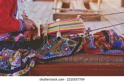 Indigenous Woman Showing Traditional Weaving Technique Stock Photo