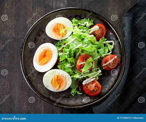 Salad with boiled eggs stock image. Image of lettuce - 77100573