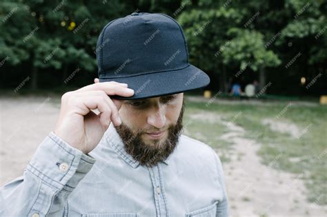 Premium Photo Hipster Handsome Male Model With Beard Wearing Black Blank Baseball Cap With