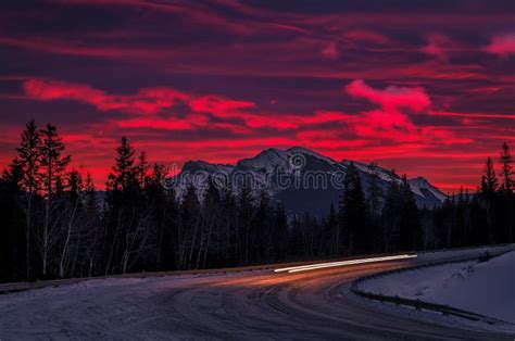 Sunrise Over Snowy Mountain Roads Stock Image - Image of scenery, mountain: 265933955