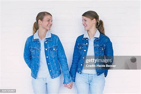 Twin Girls Holding Hands Photos And Premium High Res Pictures Getty