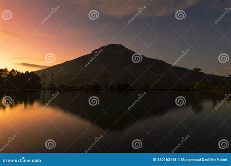 Sunrise with Mount Sumbing with Lake Surface on the Foreground Stock Photo - Image of background ...