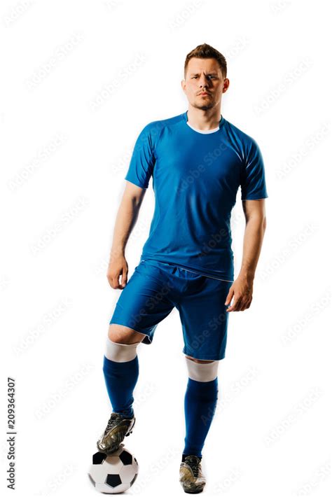 Young Handsome Football Player With A Soccer Ball Posing Isolated On