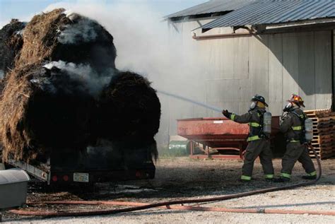 Firefighters Battle Fire In Trailer Load Of Hay With Photo Gallery