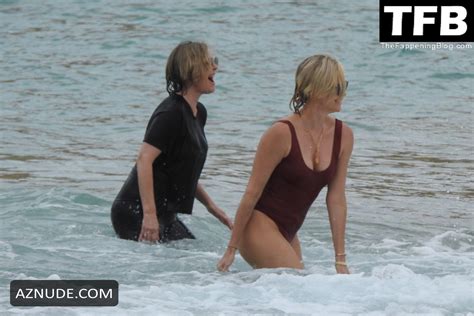 Charlize Theron Sets Pulses Racing In A Red Hot One Piece Swimsuit Aznude