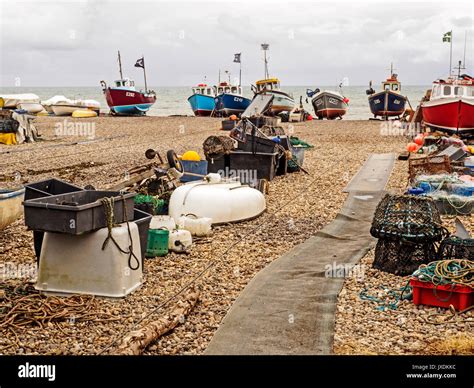 Inshore Fishing Boats Hauled Out On The Shingle Beach At Beer Devon