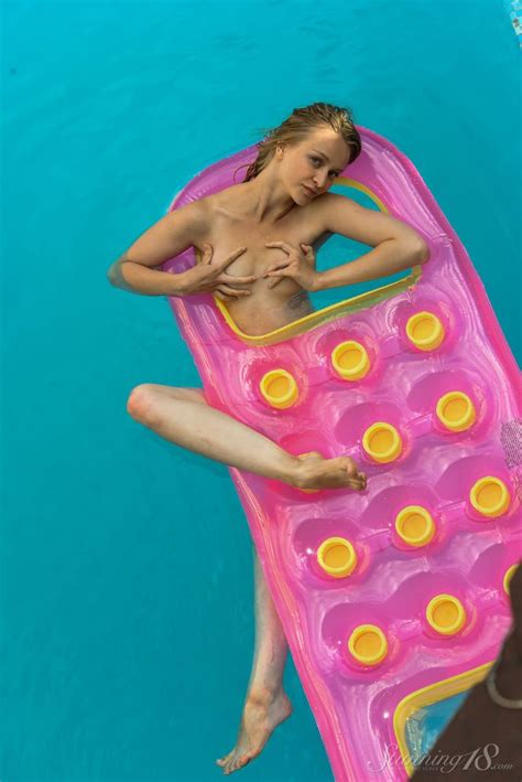 Cute Babe Enjoys Nude Swimming In The Pool Photos