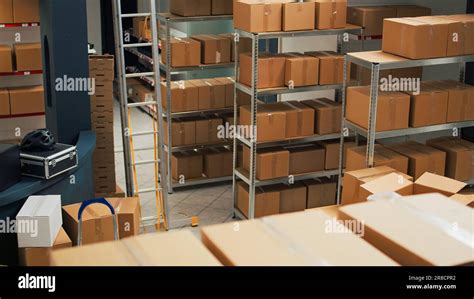 Warehouse Filled With Raw Materials And Racks To Put Cardboard Boxes