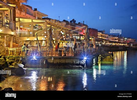 Night view of the promenade of Hersonissos, Heraklion, Crete, Greece ...