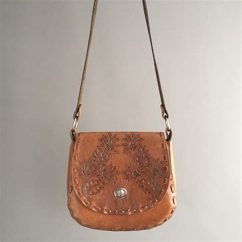 S Leather Tooled Saddle Bag