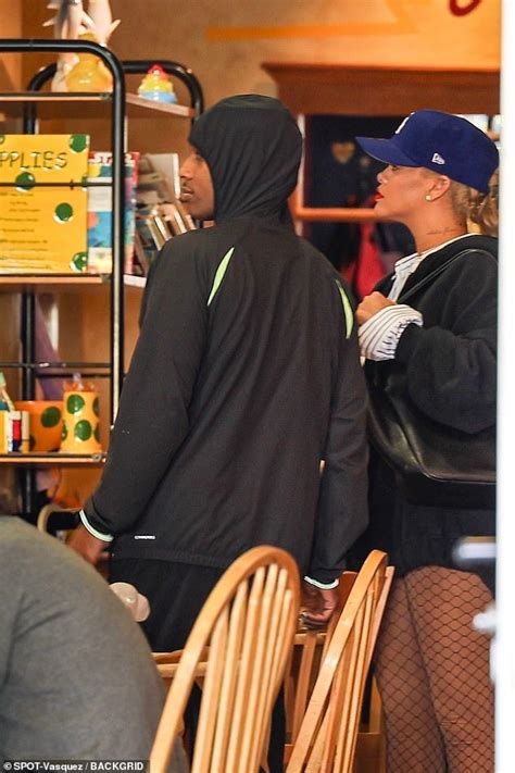 Rihanna Puts On A Leggy Display In Nude Fishnet Tights As She Keeps The Spark Alive With A AP