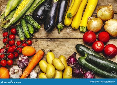 Harvest A Variety Of Ripe Vegetables From Fresh Cucumbers Tomatoes