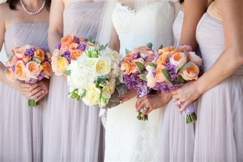 Peach Purple Bridesmaids Bouquets With Bride In Ivory