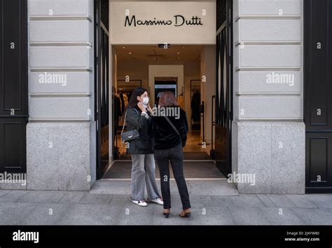 Shoppers are seen at the entrance of the Spanish clothing manufacturing ...