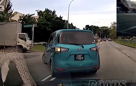 Car Stops In The Middle Of The Road To Make A Left Turn