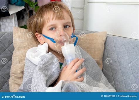 Little Caucasian Boy Making Inhalation With Nebulizer At Home Child