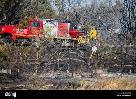 August 10 2023 Austin Fire Department Firefighters Mop Up After A Three Alarm Brush Fire At