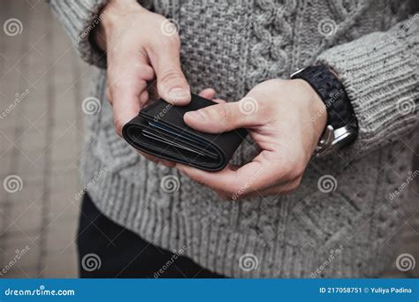 The Man Is Holding A Black Leather Wallet Stock Image Image Of Hand