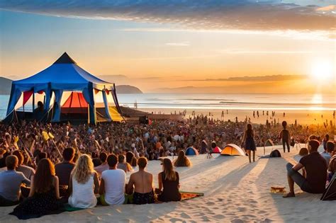 Premium AI Image | A crowd of people sit on a beach and watch a sunset.