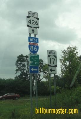 A guide marker on NB NY St Rt 426.