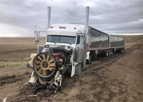 Using farm equipment to rescue a stuck semi goes spectacularly awry